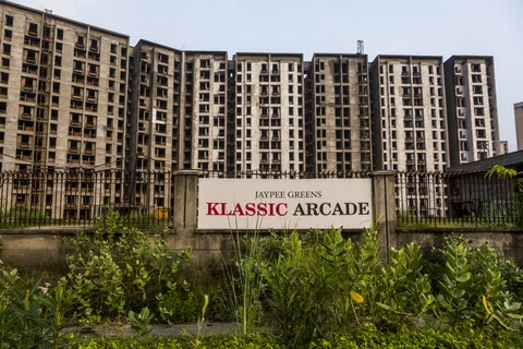 Residential buildings stand under construction at project developed by Jaypee Infratech, in Noida, Uttar Pradesh. (Photographer: Prashanth Vishwanathan/Bloomberg)