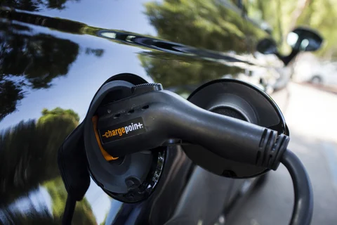 A ChargePoint Inc. charging plug sits connected to an electric vehicle at a station in Los Angeles, California, U.S. (Photographer: Dania Maxwell/Bloomberg)