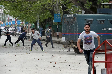 Students targeting a police vehicle during clashes outside a college in the vicinity of Lal Chowk in Srinagar on April 24, 2017. (Photographer: S Irfan/PTI)