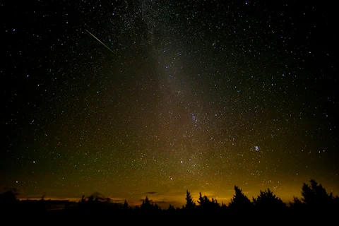 In this 30 second exposure, a meteor streaks across the sky during the annual Perseid meteor shower Friday, Aug. 12, 2016 in Spruce Knob, West Virginia. (Source: NASA)
