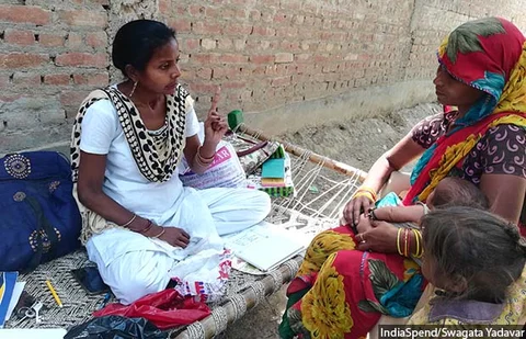 ANM Archana counselling a mother after immunisation at Badnamo village in Farrukhabad district in central Uttar Pradesh.
