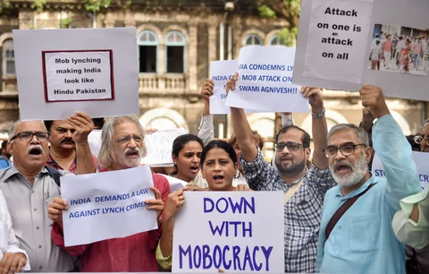 Documentary filmmaker Anand Patwardhan with other activists raise slogans to condemn mob lynching, in Mumbai on July 19, 2018. (Photographer: Shashank Parade/PTI) 