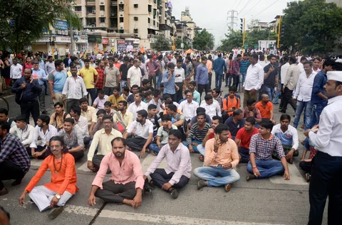 Maratha community people stop the traffic during their Maratha Kranti Morcha Rasta Roko protest demanding reservation, in Thane, Mumbai on Wednesday, July 25, 2018. (Source: PTI)