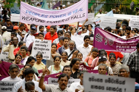 People participate in a peace rally organized by the National Anti War Front, in, Colombo, Sri Lanka on August 17, 2006. (Photographer: Sebastian Posingis/Bloomberg News)
