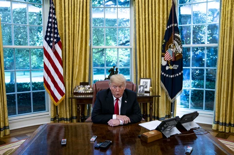 U.S. President Donald Trump speaks during an interview in the Oval Office of the White House in Washington, D.C., U.S. (Photographer: Al Drago/Bloomberg)