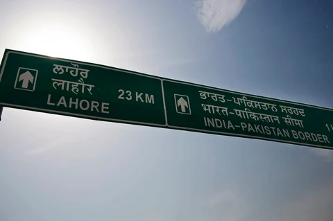 A road sign for the India-Pakistan border stands in Attari, India. (Photographer: Brent Lewin/Bloomberg)
