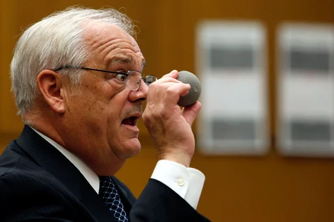 Michael Kelly, attorney for plaintiff Loren Kransky, holds up an ASR XL hip implant made by Johnson & Johnson at a trial in Los Angeles, California, on Jan. 25, 2013. (Photographer: Patrick T. Fallon/Bloomberg)