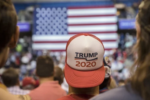 An attendee wears a ‘Trump 2020’ hat before the start of a rally with U.S. President Donald Trump in Wilkes-Barre, Pennsylvania, U.S., on Aug. 2, 2018. (Photographer: Victor J. Blue/Bloomberg)