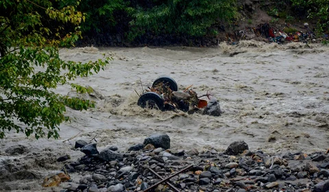 A mangled vehicle in the flash floods caused by the rains. (PTI) 