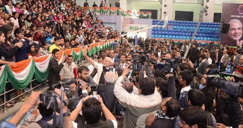 Then Gujarat Chief Minister Narendra Modi greets students at the Shri Ram College of Commerce, after his speech, in New Delhi, on February 6, 2013. (Photograph: narendramodi.in)