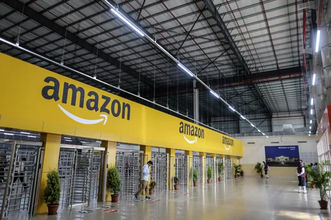 An employee exits the warehouse floor of the Amazon.com Inc. fulfillment center in Hyderabad. (Photographer: Dhiraj Singh/Bloomberg)