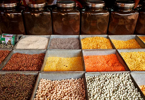 Pulses (lentils and beans) are displayed for sale at a market in Mumbai. (Photographer: Adeel Halim/Bloomberg). 