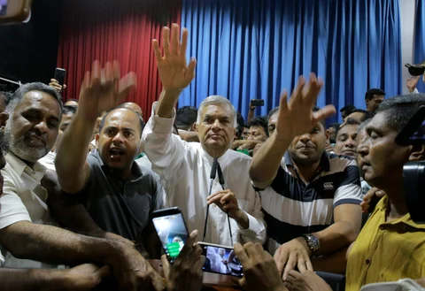 Sri Lanka’s sacked Prime Minister Ranil Wickeremesinghe interacts with his supporters at his official residence in Colombo, Sri Lanka, on Oct. 27, 2018. (Photograph: AP/PTI)