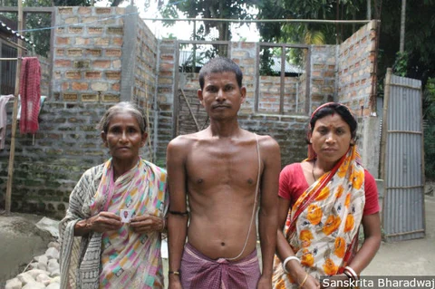 Mahendra Barman, 30, (centre) with his mother and wife. Mahendra’s father, Deben Barman, 70, hung himself from a tree on Aug. 7, 2018.