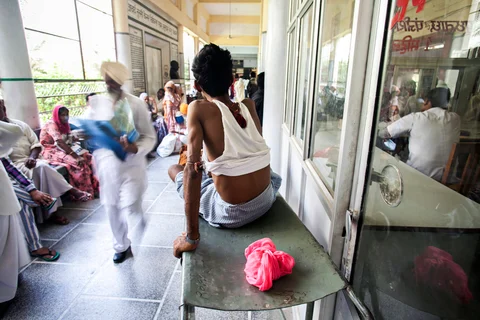 Patients wait for treatment in the corridor of the Acharya Tulsi Regional Cancer Treatment & Research Institute in Bikaner, Rajasthan. (Photographer: Prashanth Vishwanathan/Bloomberg)