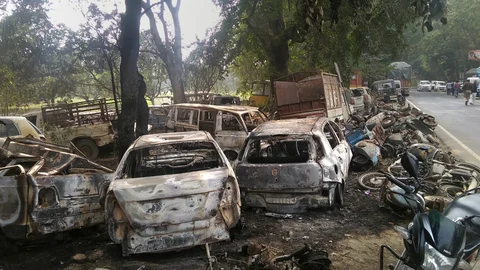 Charred vehicles which were set on fire by a mob in violent clashes on Dec. 3, over the alleged illegal slaughter of cattle in Bulandshahr, Uttar Pradesh. (Photograph: PTI)