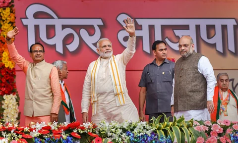 Prime Minister Narendra Modi with then-Chief Minister Shivraj Singh Chouhan and BJP President Amit Shah, in Bhopal, on Sep. 25, 2018. (Photograph: PTI)
