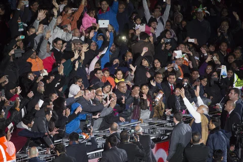 Prime Minister Narendra Modi waves to the crowd at Wembley Stadium in London. (Photographer: Simon Dawson/Bloomberg)