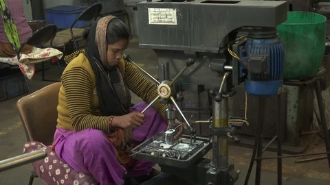 A worker makes nuts and bolts for tractors at Ohri Industries Ltd., Mohali. (Source: BloombergQuint)