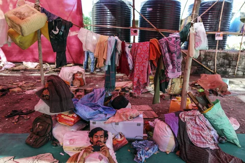 A ‘water migrant’ from rural Maharashtra, in Thane on the outskirts of Mumbai. (Photographer: Dhiraj Singh/Bloomberg)