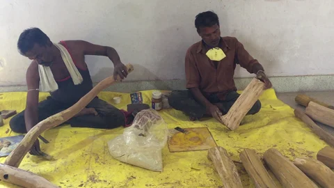 Artisans prepare logs of sandalwood before it’s processed into various shapes at Rural Artisans Craft Centre in Metagalli, Mysuru. (Photographer: Nishant Sharma/BloombergQuint)