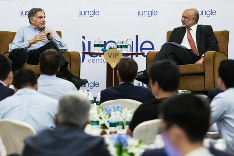 Ratan Tata speaks as Piyush Gupta of DBS Group listens during a session advising startups. (Photographer: Nicky Loh/Bloomberg)