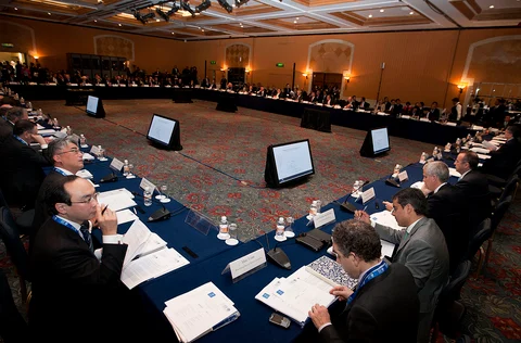 Attendees listen during an event ahead of the Group of 20 finance ministers in Mexico City, on Feb. 24, 2012. (Photographer: Susana Gonzalez/Bloomberg).
