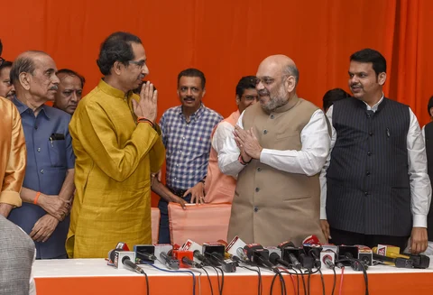 Amit Shah greets Uddhav Thackeray after the announcement of an alliance between Shiv Sena and BJP, in Mumbai, on Feb. 18. 2019. (Photograph: PTI)