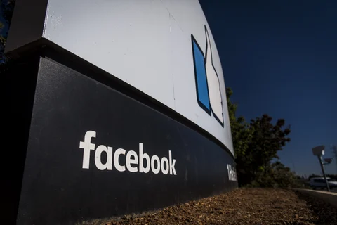 Signage is displayed outside Facebook Inc. headquarters in Menlo Park, California. (Photographer: David Paul Morris/Bloomberg)