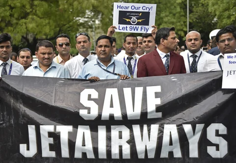 Cabin crew hold placards during a protest organized by Jet Airways India Ltd. employees at Jantar Mantar in Delhi, India (Photographer: Anindito Mukherjee/Bloomberg) 
