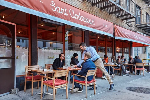 The elegant Milanese outpost, with prime sidewalk seating in SoHo (bottom), serves everything from cocktails to pastries and slider-sized sandwiches. 
