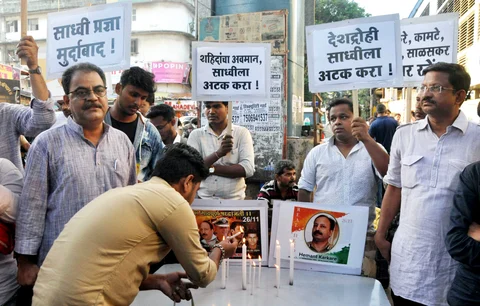 People stage a protest to condemn Pragya Singh Thakur’s comments against martyred police officer Hemant Karkare, in Mumbai, on April 20, 2019. (Photograph: PTI)