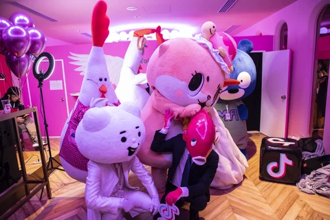 People dressed in costumes pose for photographs during the TikTok Creator’s Lab 2019 event hosted by Bytedance Ltd. in Tokyo, Japan (Photographer: Shiho Fukada/Bloomberg) 