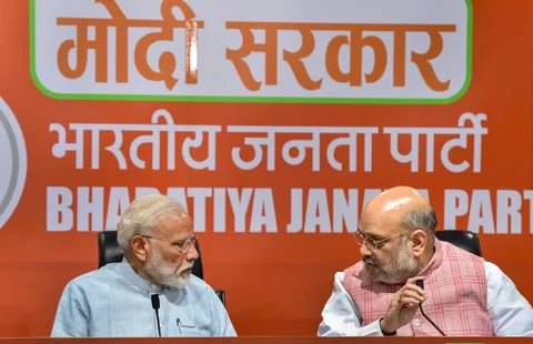 Prime Minister Narendra Modi with BJP President Amit Shah during a press conference at the party headquarter in New Delhi (Source: PTI)