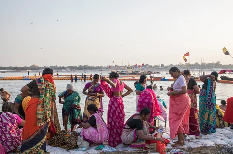 In Prayagraj, pilgrims visit the Triveni Sangam, where the Ganges meets the Yamuna and Saraswati rivers. (Photographer: Anshika Varma for Bloomberg Businessweek)