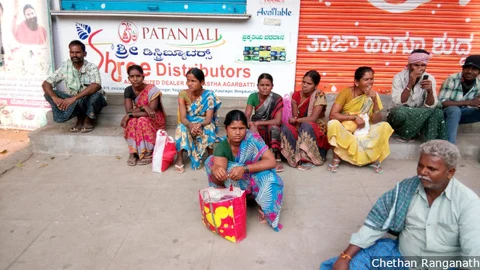 Women workers wait to be picked for work in Bengaluru’s Kurubarahalli labour hub. The employment squeeze felt after demonetisation hit women hardest. 