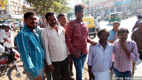 Swamy (second from left), an unskilled worker, migrated from Mandya district in southwestern Karnataka to Bengaluru in search of job opportunities that could help him give his three daughters an education. Swamy must now be satisfied with two to three days of work a week.