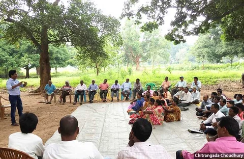 Gladson Dundung (left) during a village meeting on land and forest policies in Khunti, Jharkhand.