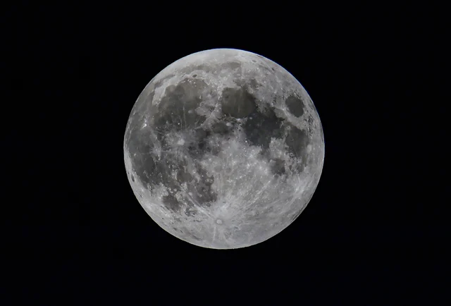 A view of the moon during a partial lunar eclipse, as seen from New Delhi, early Wednesday, July 17, 2019