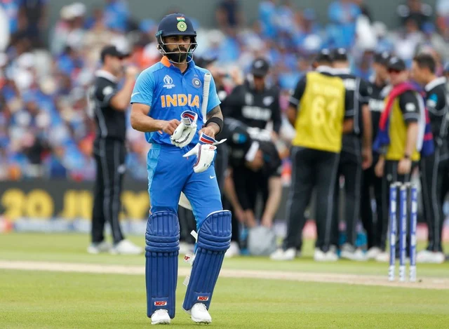 Indian captain Virat Kohli leaves the ground after being dismissed during the Semi Final match against New Zealand during ICC CWC 2019 at Old Trafford in Manchester on Wednesday.