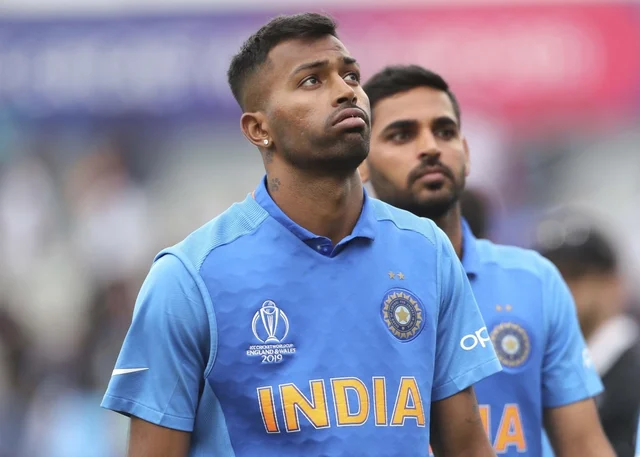 Hardik Pandya, left, reacts after their loss in the World Cup semi-final match against New Zealand.