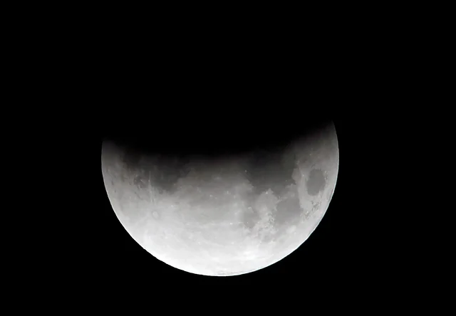 The moon is seen during a partial lunar eclipse in Islamabad