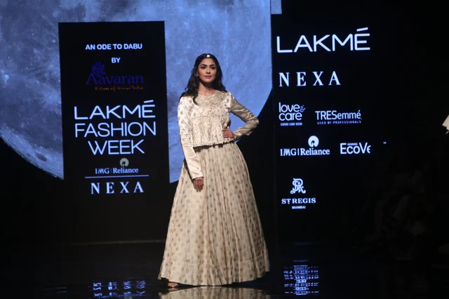 Mrunal wore a mulberry silk, ivory, gold lehenga with ornate embroidery, teamed by a bandhgala, full sleeve top.
