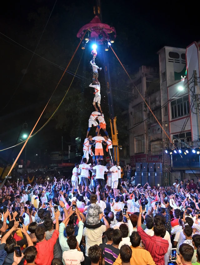 Participants form a human pyramid as they try to break 'Dahi-handi' during a competition on the occasion of Janmashtami festival at Kamania Gate, in Jabalpur