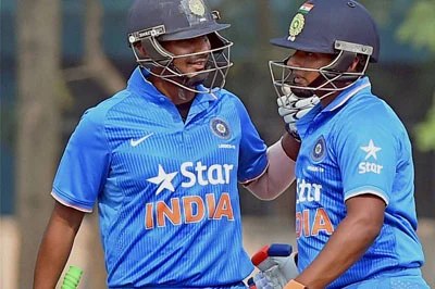 Kolkata: Indian U-19 cricketer Sarfaraz Khan celebrates after completing his 50 with Captain Ricky Bhui during U-19 Tri Series Final aganist Bangladesh at Salt Lake in Kolkata on Sunday. PTI Photo by Ashok Bhaumik(PTI11_29_2015_000080B)