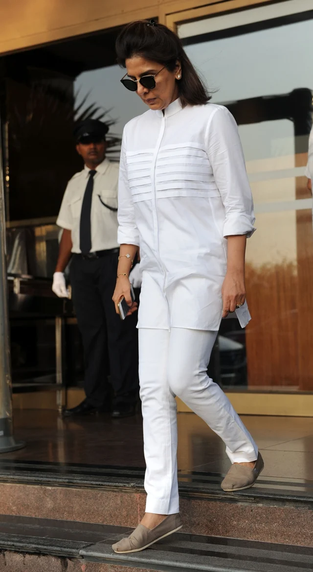 Neetu Singh attends a prayer meeting for the late Krishnaraj Rai – the father of actress Aishwarya Rai Bachchan – in Mumbai on March 21, 2017. / AFP PHOTO / STR