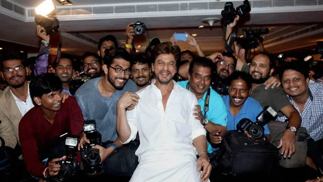 Mumbai: Shahrukh Khan with his fans on the occasion of Eid al-Fitr Festival, in Mumbai on Monday. PTI Photo