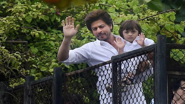 Mumbai: Shahrukh Khan along with son Abram greets his fans on the occasion of Eid, at his residence in Mumbai. PTI Photo by Mitesh Bhuvad