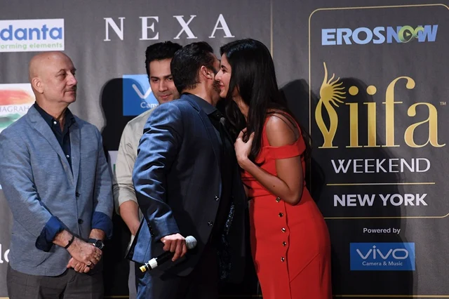 Bollywood actor Salman Khan (C) greets actress Katrina Kaif (R) as Anupam Kher (L) and Varun Dhawan look on during a press conference ahead of the 18th International Indian Film Academy (IIFA) Festival, in New York City July 13, 2017.