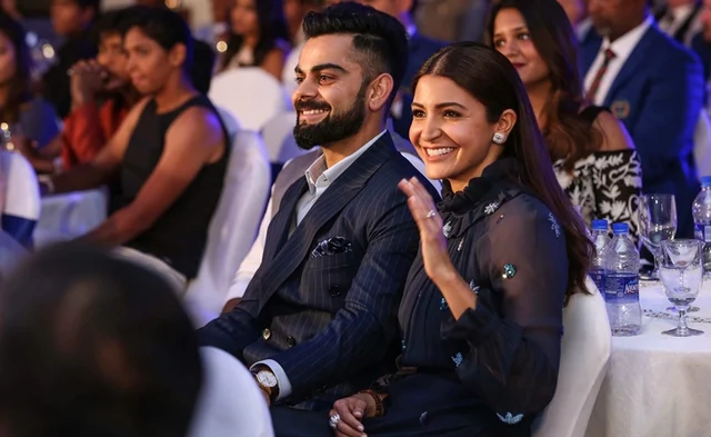 Indian cricket captain Virat Kohli with his wife and Bollywood actor Anushka Sharma during the 6th M A K Pataudi Memorial Lecture and BCCI Awards, in Bengaluru. PTI Photo/BCCI